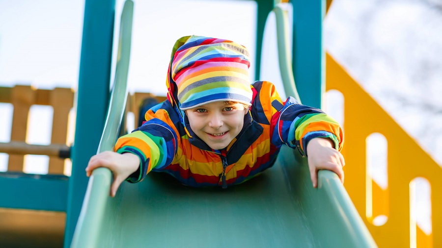 Child sliding on a slide