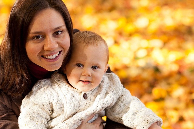 Mom and baby in autumn